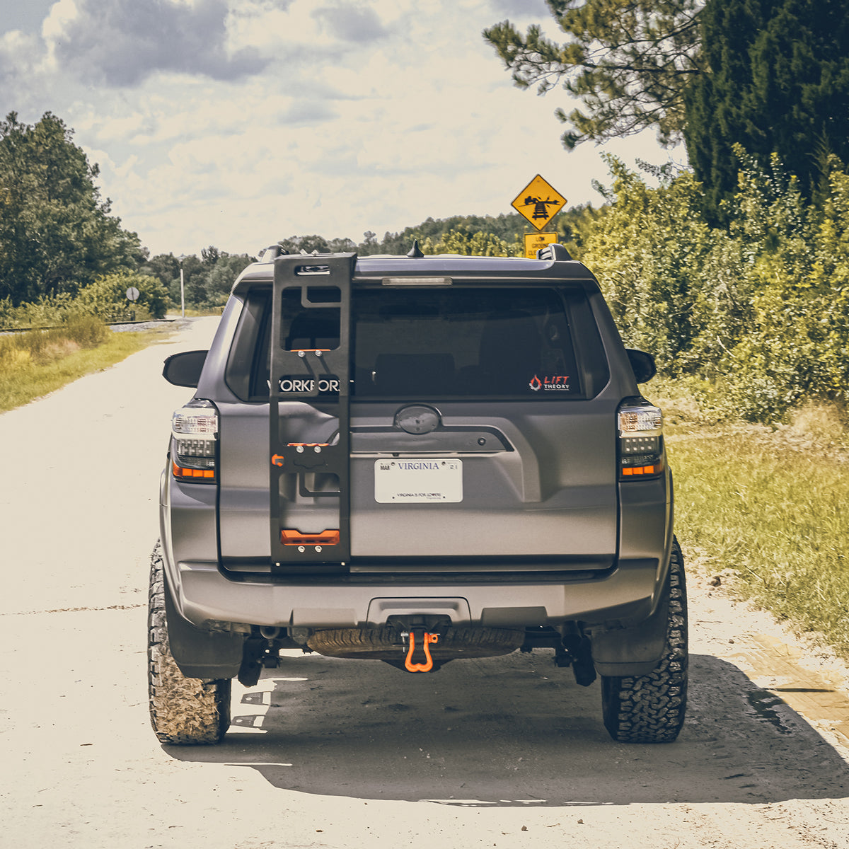 Orange Truck Nuts Shackle on the back hitch receiver of a Toyota 4 Runner