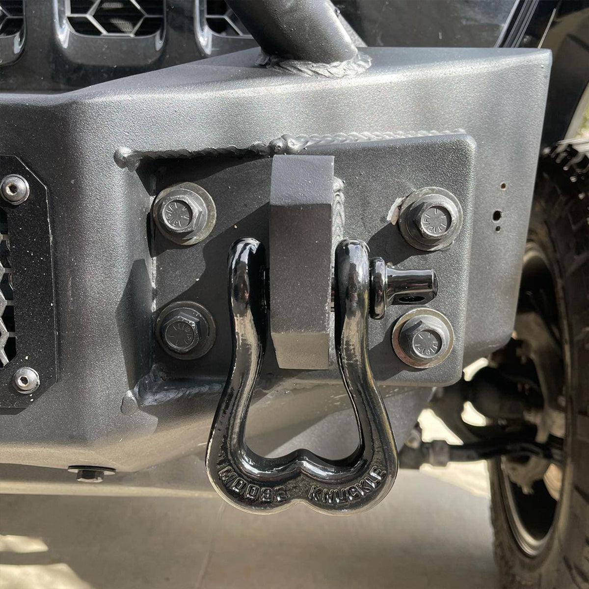 Black Jeep Recovery Shackle on the front of a Wrangler JK custom bumper shackle mount | Moose Knuckle Offroad