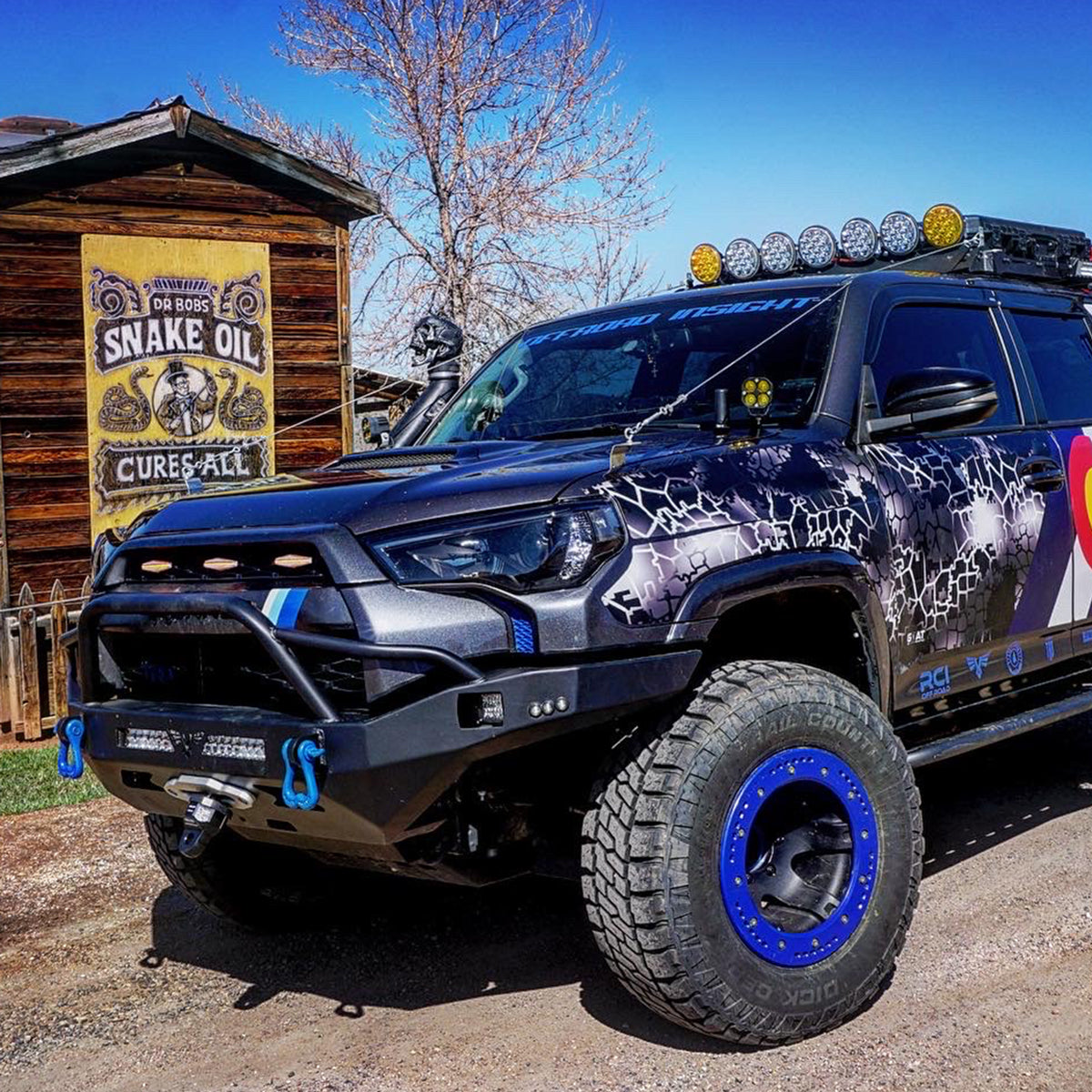 Blue Tow Shackles on the front bumper of a toyota 4runner lighted front bumper | Moose Knuckle Offroad
