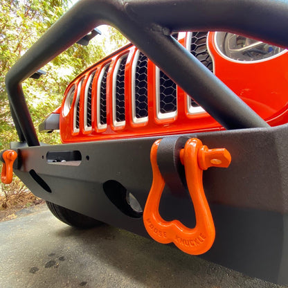 Orange D-Ring Shackles on the front bumper of a Jeep Wrangler | Moose Knuckle Offroad