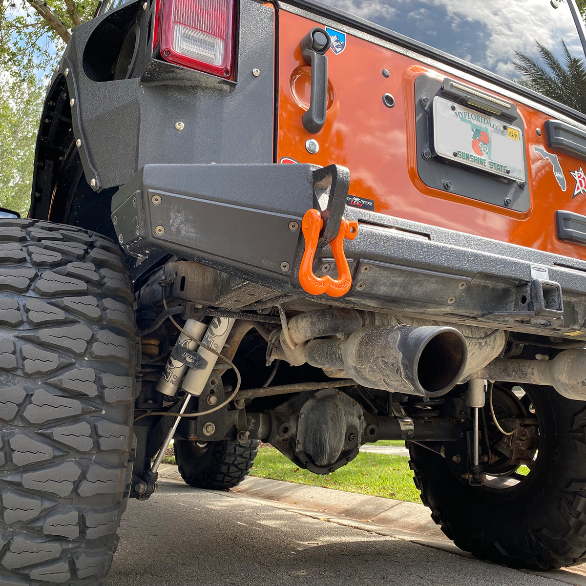 Obscene Orange Shackle on the rear shackle mount of a Jeep Wrangler JK customer rear bumper | Moose Knuckle Offroad